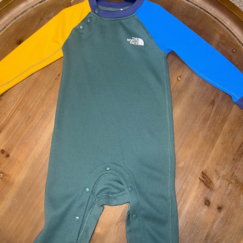 The North Face Blue and Yellow Footies One Piece